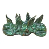 A green patinated bronze group of three seated foxes by Raoh Schorr, bronze, sold Dec 2024