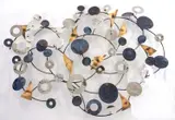 Chrome plated discs and burnished metal wall sculpture by Curtis Jeré, sculpture, sold May 2025