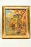 A continental scene with houses beside a lake by Hans Pawlitschek, oil on canvas, sold Mar 2023