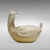 Lattimo Oro Duck, model 2584 by Tomaso Buzzi, 1933, lattimo glass with gold leaf and applied details, sold Mar 2023