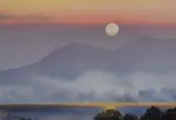 Sunset over Derwentwater' signed lower left, within a card mount and slender frame, under glass, entitled verso, 24.5cm x 36cm & 41cm x 51cm by Jim Ridout, watercolor, offered Mar 2023