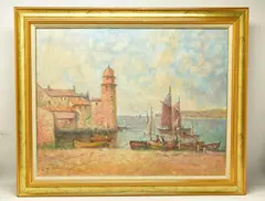 A continental coastal landscape with fishing boats on the shore by Laszlo Ritter, oil on canvas, offered Dec 2022