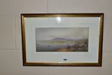 A view across a bay to a village backed by snow topped hills by Percival Hart, watercolour on paper, sold Nov 2022
