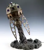 Verne's Jewel by Jeff DeBoer, Bronze sculptural rocket lamp with cobalt glass windows, sold Dec 2022