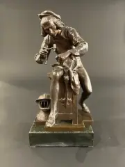 Armurier travaillant by Adrien Étienne Gaudez, Bronze patiné, sold Jan 2025