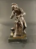 Armurier travaillant by Adrien Étienne Gaudez, Bronze patiné, sold Jan 2025