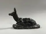Biche couchée les oreilles levées by Clovis-Edmond Masson, Épreuve en bronze à cire perdue à patine médaille signée sur la terrasse, sold Dec 2024