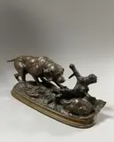 Chien à l'arrêt devant un lièvre by Édouard Delabrierre, Épreuve en bronze à patine médaille signé sur la terrasse, sold Dec 2024