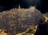 Vue de Tolède by Serge Rovinski, 1944, Panneau mural à quatre éléments en bois laqué or et brun sur fond noir, sold Nov 2022