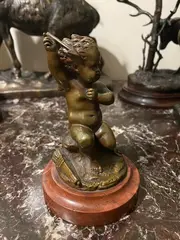 Ange de l'amour by Louis Kley, Bronze patiné sur socle en marbre griotte, sold Apr 2022