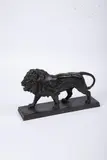 Lion qui marche (avec plinthe rectangulaire) by Antoine-Louis Barye, Epreuve en bronze à patine brun vert, sold Nov 2024