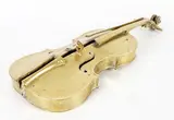 Split violins by Fernandez Arman, 1972, Bronze poli à patine dorée, sold Apr 2024
