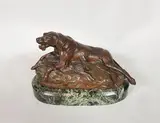 Braque couché sur un lièvre, langue pendante by Émile-Louis Truffot, Epreuve en bronze à patine brun nuancé rouge, sold Dec 2019