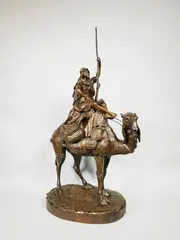 Guerrier arabe sur son dromadaire by Émile Pinedo, Epreuve en bronze à patine brun nuancé, sold Dec 2019