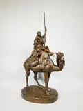 Guerrier arabe sur son dromadaire by Émile Pinedo, Epreuve en bronze à patine brun nuancé, sold Dec 2019