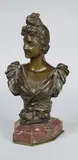Buste de femme au chignon by Georges Van der Straeten, Epreuve en bronze à patine brun nuancé, fonte d'édition ancienne signée au dos, sold Dec 2018