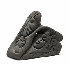 Sandstone Sculpture by Lonnie Holley, Carved black sandstone sculpture with several faces, sold Nov 2025