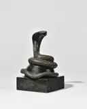 Presse-papier au serpent dressé ou enroulé by Jean Dunand, 1915, Bronze ciselé et patiné sur une demi-sphère noire et base carrée en marbre, sold Nov 2025