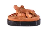A terracotta group of a dog with her three young puppies by Joseph Gott, sculpture, sold Jun 2024