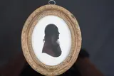 Silhouette of a gentlemanpainted plasterlooking to sinister by John Miers, sculpture, sold Jun 2024