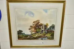 A pastoral landscape with ruined castle beside a river by Donald Ayres, watercolour on paper, sold Jan 2022