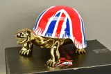 Union jack golden peace turtle by Diederik van Apple, sculpture, sold Dec 2021