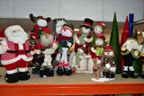 freestanding, comprising eight snowmen: one family by Twelve Large Fabric Christmas Figure Decorations, sculpture, sold Dec 2021
