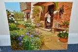 A nostalgic scene with a female figure darning on ths step of a cottage by John Haskins, oil on board, offered Dec 2021