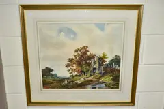 A pastoral landscape with ruined castle beside a river by Donald Ayres, watercolour on paper, offered Dec 2021