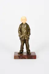Girl in a trouser suit patinated bronze and ivory on red veined by Solange Bertrand, bronze and ivory, offered Oct 2021