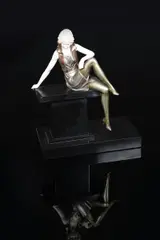 Girl on a Wall bronze and ivory sculpture on a polished black slate by Ferdinand Preiss, bronze and ivory, sold Aug 2021