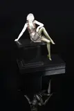 Girl on a Wall bronze and ivory sculpture on a polished black slate by Ferdinand Preiss, bronze and ivory, sold Aug 2021