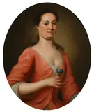 Portrait of a lady, said to be Mrs. Ruston, wife of Mr. John Ruston of St.James, London, half-length, in a pink dress, holding a flower by English School, oil on canvas, oval, sold Dec 2014