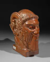 Tête de faune by Léopold Renard, Terre cuite patinée signée deux fois sur la terrasse et située Lyon, sold Nov 2024