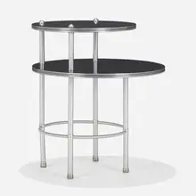 Two-tier occasional table, model 1571 by Warren McArthur, 1934, aluminum, Formica, sold Jan 2023