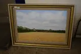 A view over a cornfield to Worstead Church by Ray Canham, oil on canvas, sold Jul 2024