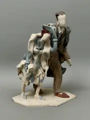 A stoneware sculpture of a couple walking in the wind by Audrey Blackman, 1963, sculpture, sold Feb 2026