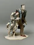 A stoneware sculpture of a couple walking in the wind by Audrey Blackman, 1963, sculpture, sold Feb 2026