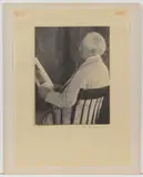 MAN HOLDING ULMANN PORTRAIT PHOTOGRAPHIC PORTRAIT, platinum print on tissue paper depicting a sitting gentleman gazing at one of Ulmann's portrait photographs by Doris Ulmann Jaeger, pencil signature ", sold Jun 2024