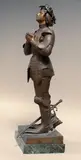Sainte Jeanne d’Arc en prière by Antonin Mercié, Bronze à patine brune et mordoré, sold May 2023