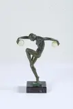 sous le pseudonyme de DENIS et Max LE VERRIER (1891-1973) Jongleuse by Marcel-André Bouraine, Epreuve en alliage cuivreux patiné vert et onyx sur une base à gradin en marbre veiné, sold Feb 2024