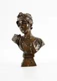 Femme au ruban dans les cheveux by Emmanuel Villanis, Bronze à patine brune, sold Sep 2023