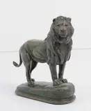 Lion debout by Alfred Barye, Épreuve en bronze à patine verte nuancée, sur terrasse ovale, sold Oct 2025