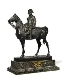 L'Empereur Napoléon Ier à cheval by Jules Edmond Masson, Bronze à patine foncée sur socle en marbre vert garni d'un aigle en bronze doré, sold Oct 2025
