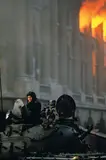 Incendie du palais, révolution roumaine by José Nicolas, 1989, Tirage couleur lambda, légendé et signé au dos par le photographe, sold Feb 2025