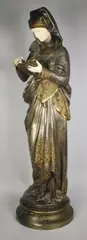 La liseuse by Albert-Ernest Carrier-Belleuse, Epreuve en bronze à double patine et ivoire, sold Oct 2017