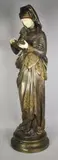 La liseuse by Albert-Ernest Carrier-Belleuse, Epreuve en bronze à double patine et ivoire, sold Oct 2017