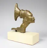 La Croisière Noire, Femme Mangbetu. Mascotte de bouchon de radiateur by Gaston Broquet, Epreuve en bronze à patine brun clair nuancé, sold May 2017