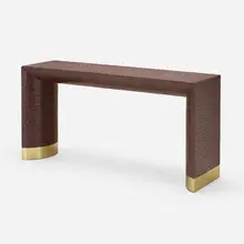 Belly console by Harrison Van-Horn, c. 1990, lacquered grass over wood, brass, sold Jan 2023
