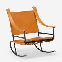 Rocking chair by Jacques Adnet, c. 1950, saddle-stitched leather, enameled steel, brass, sold Jan 2023